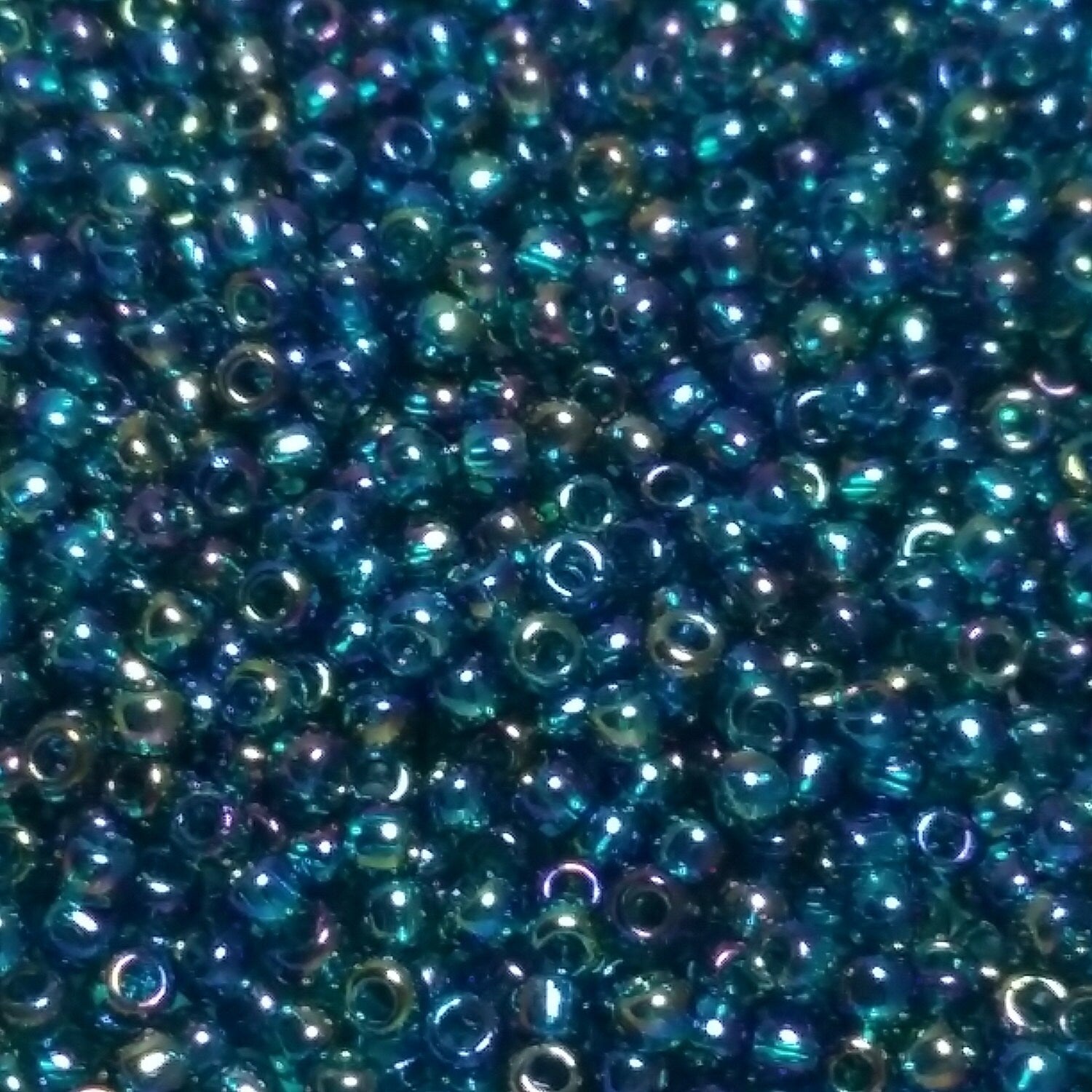 Transparent-Rainbow Teal TOHO Seed Glass 11/0 - 10g