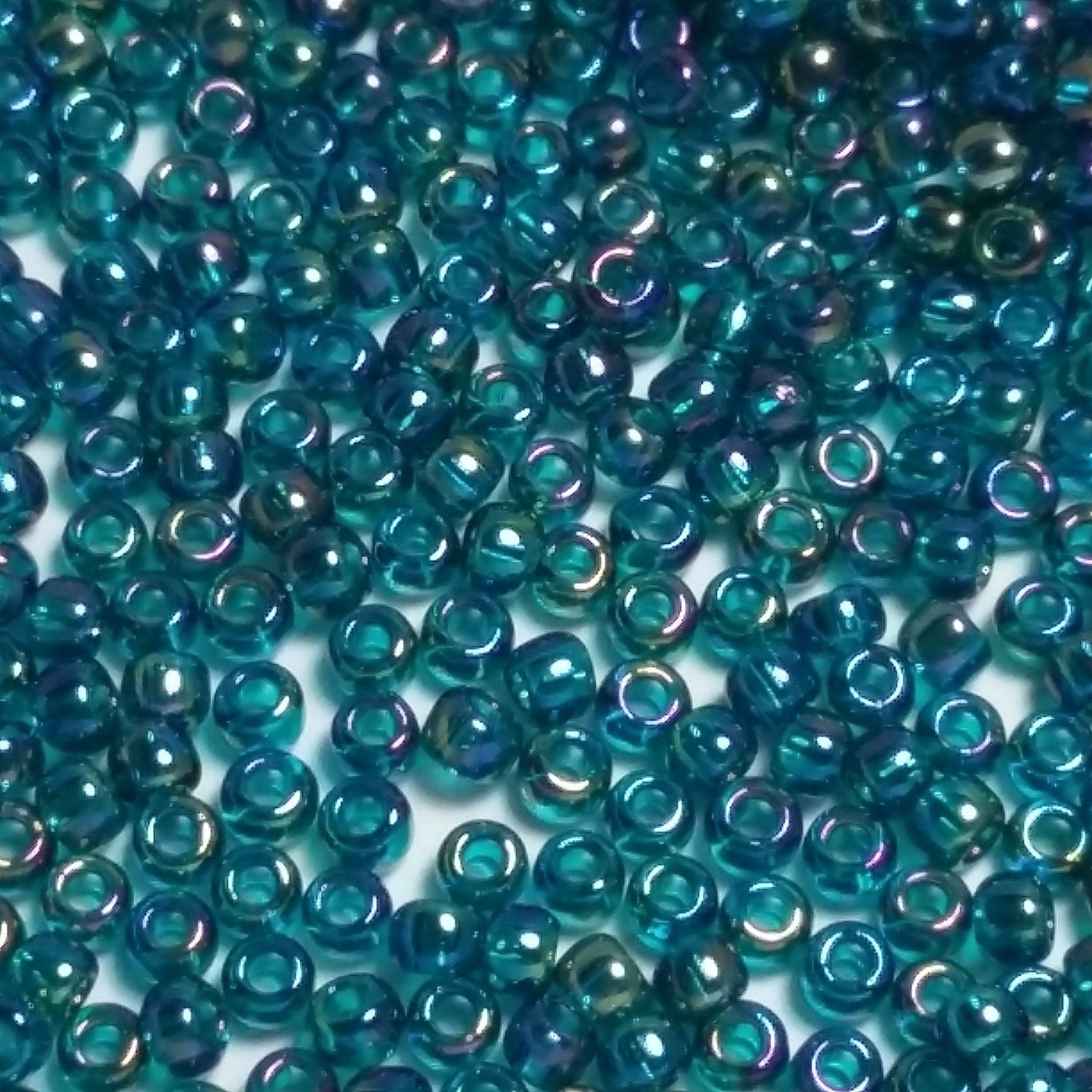 Transparent-Rainbow Teal TOHO Seed Glass 11/0 - 10g